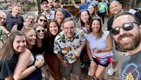 a group of people posing for a selfie