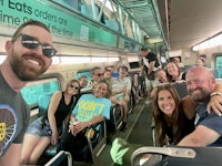 a group of people on a train taking a selfie